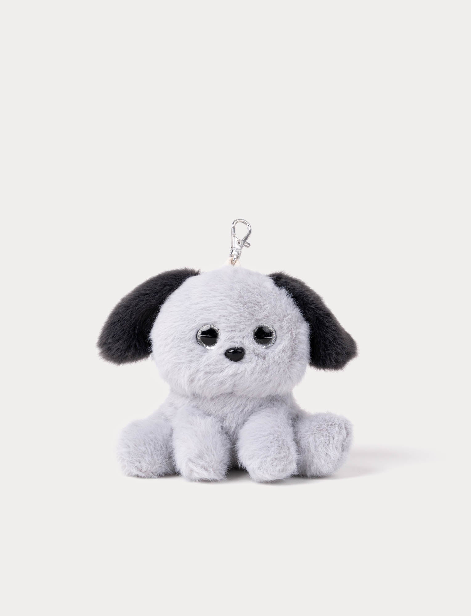  Image of Plush dog keychain with black ears on a white background