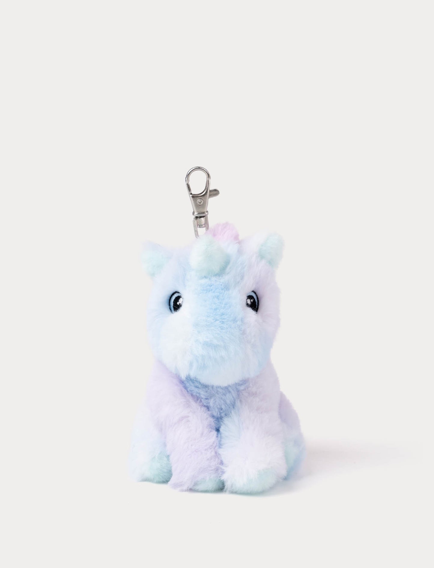 Purple plush unicorn keychain on a white background