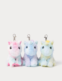 Three colorful unicorn keychains on a white background