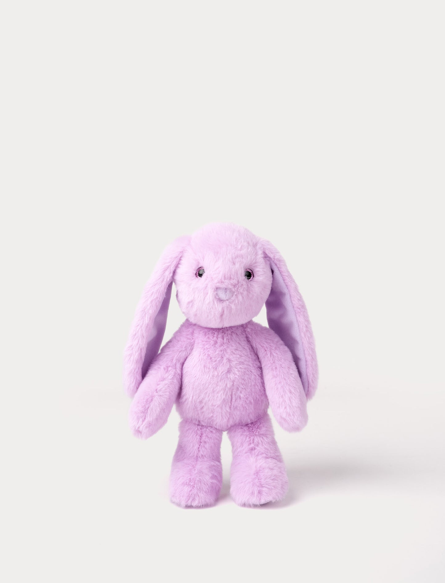 Purple plush bunny toy on a white background