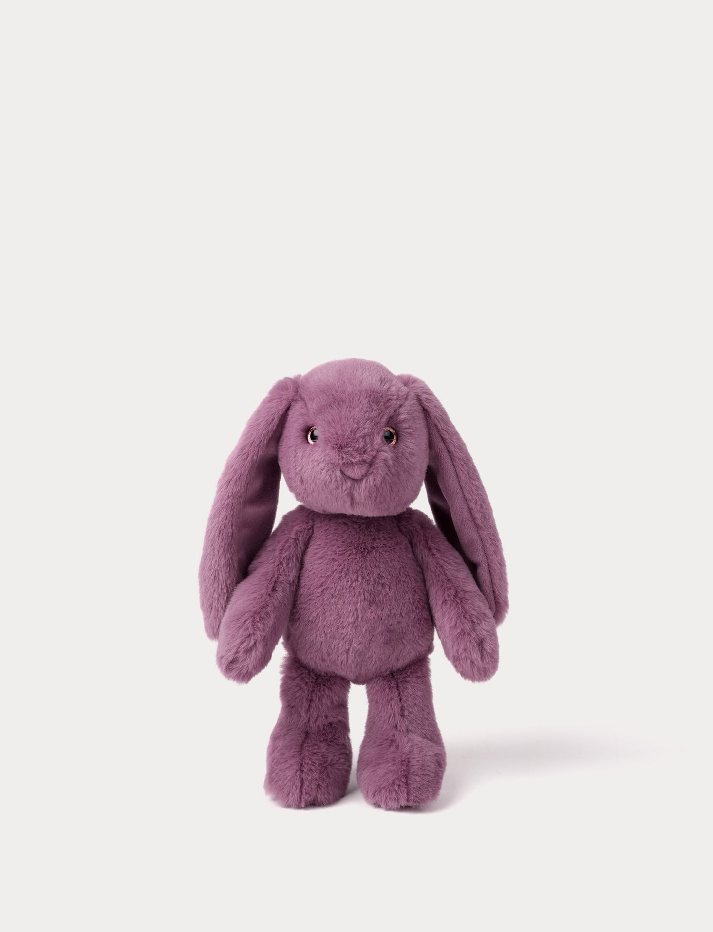 Purple plush bunny toy on a white background