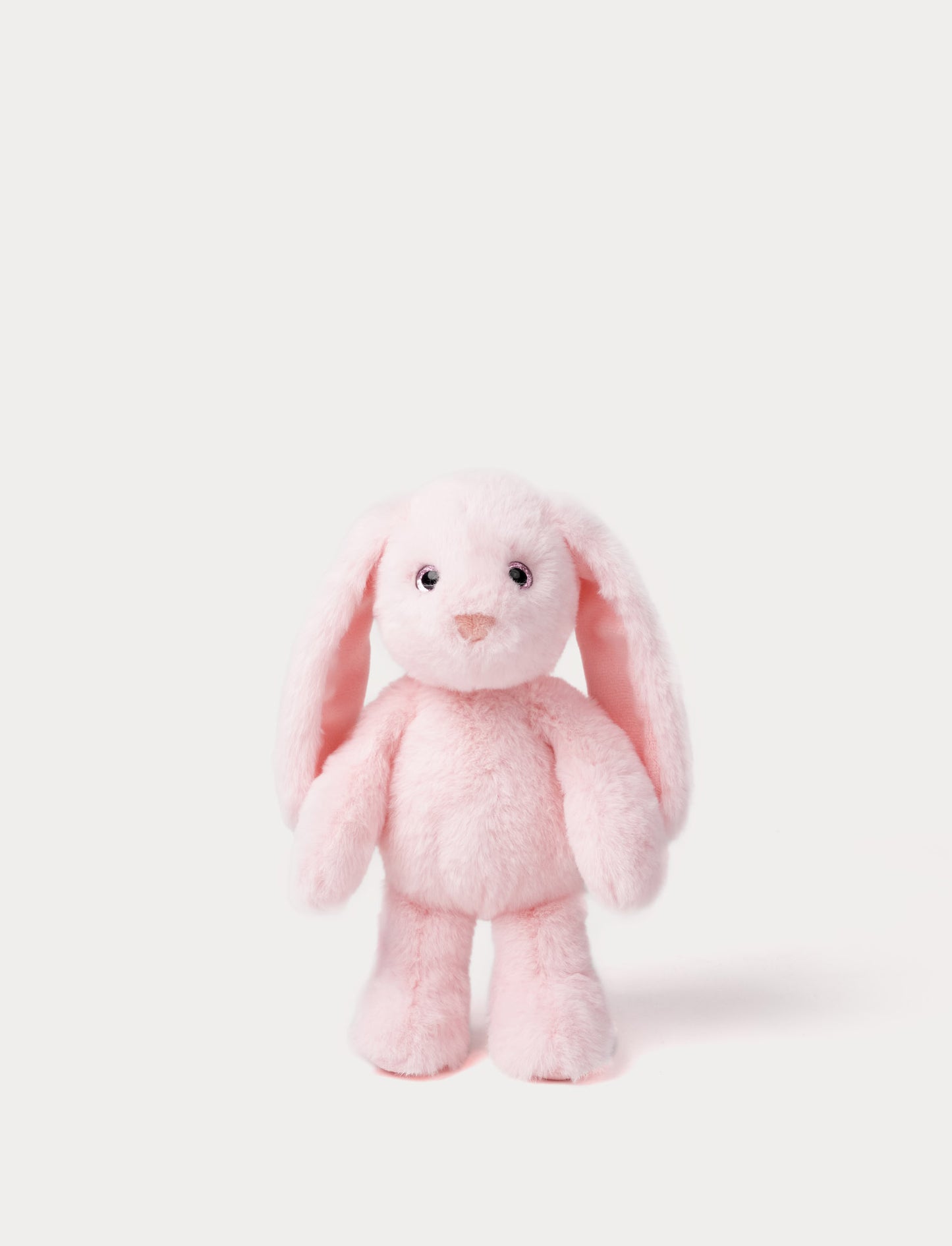 Pink plush bunny toy on a white background