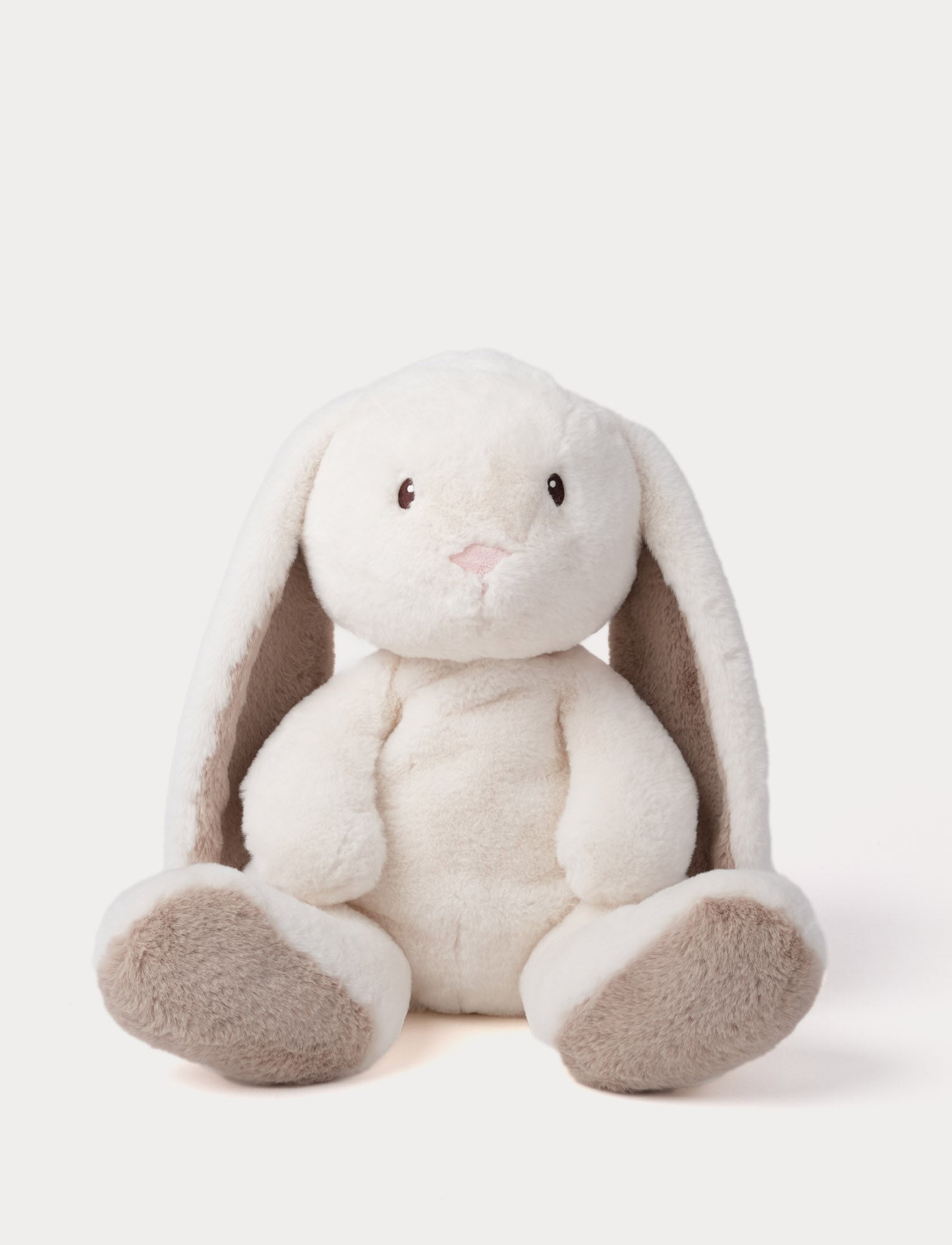  Image of Plush toy rabbit with white fur and brown ears on a light background