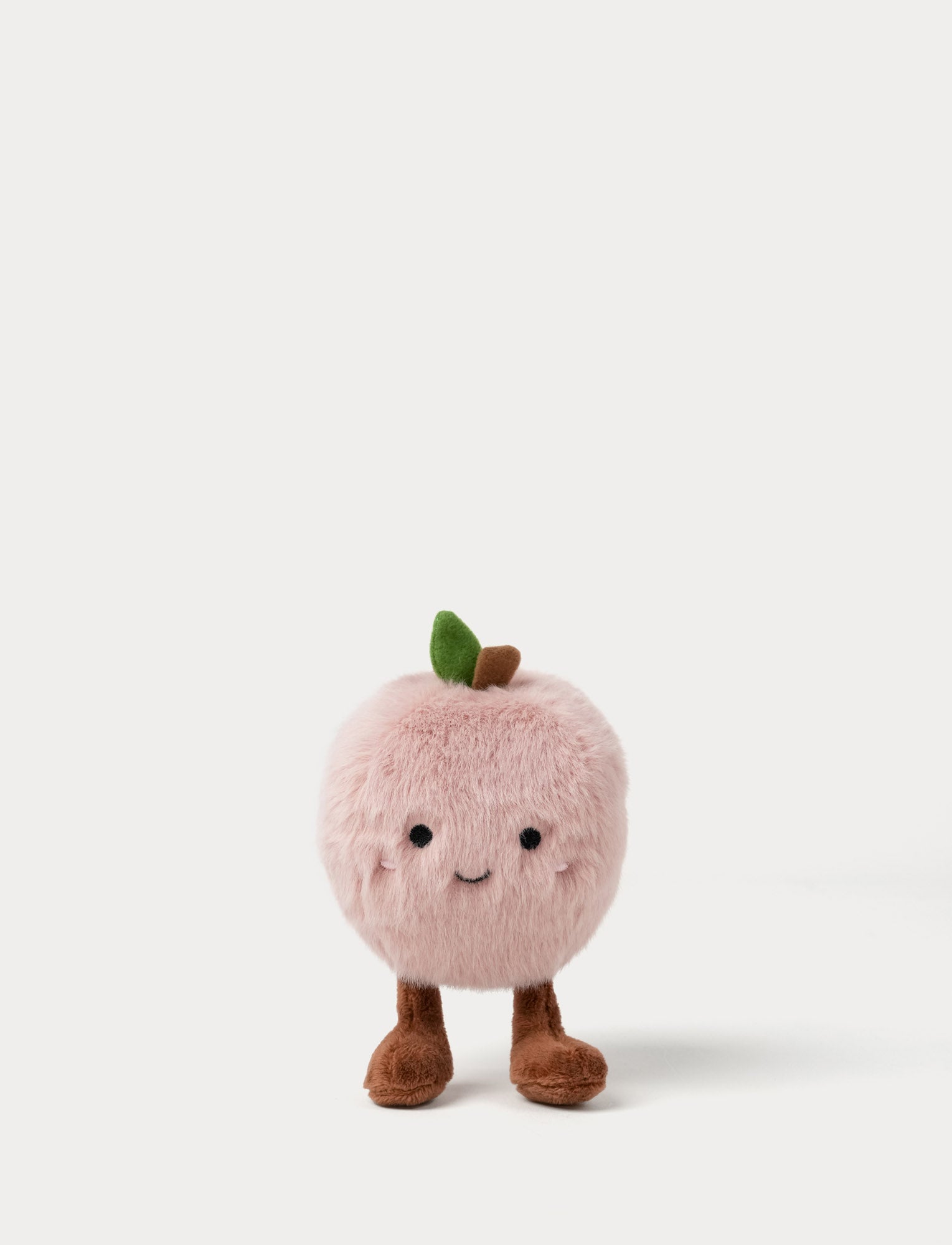  Image of Plush toy shaped like a pink apple with a smiling face, cute legs and a green leaf 