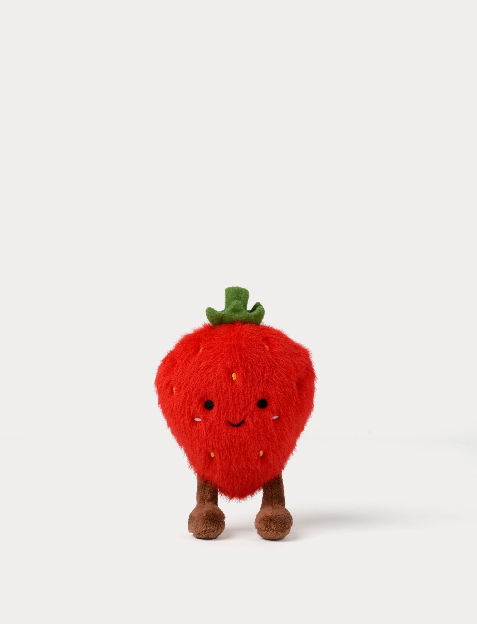  Image of Plush strawberry toy with a smiling face on a white background
