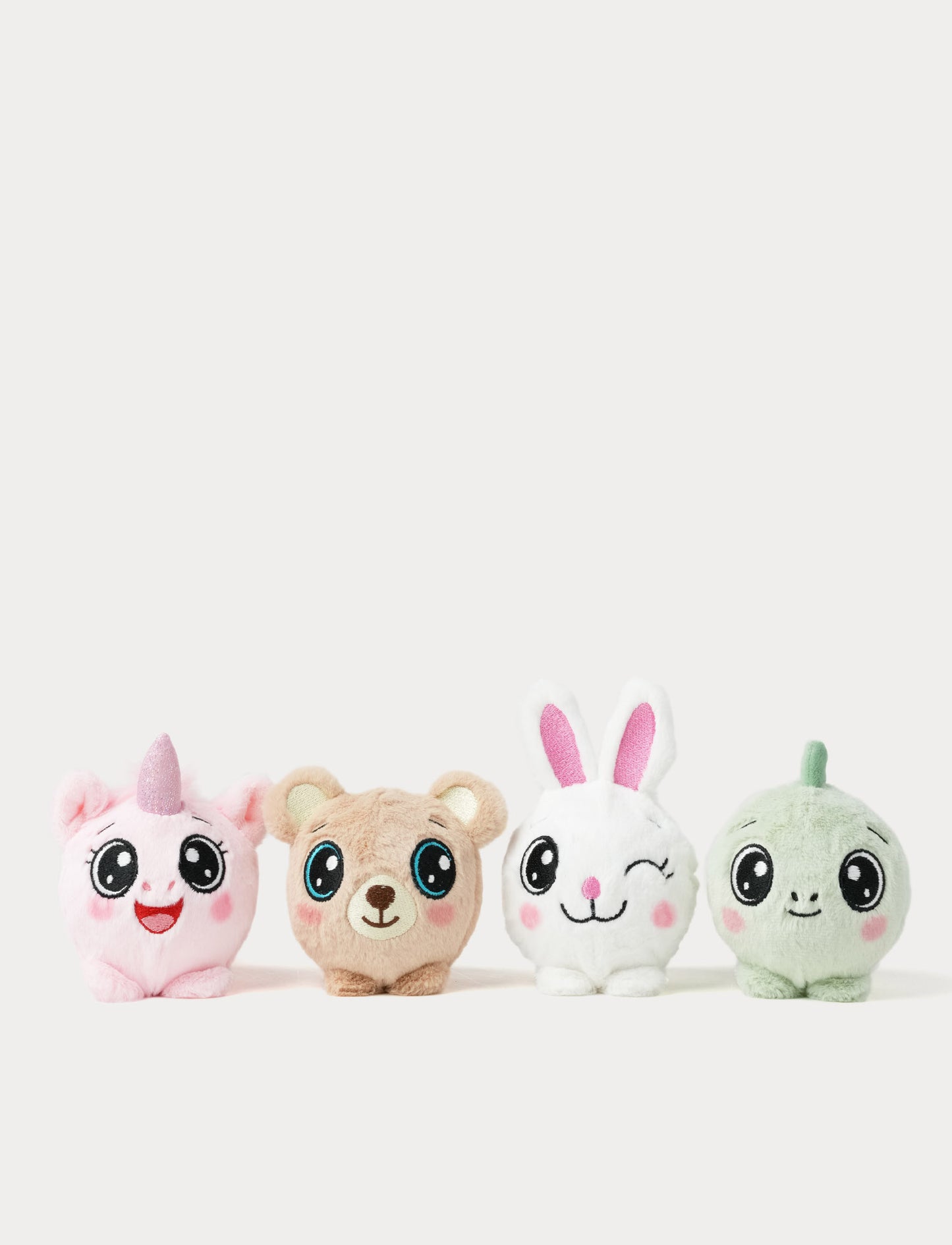 Four plush bouncy balls. Unicorn, teddybear, bunny & dino