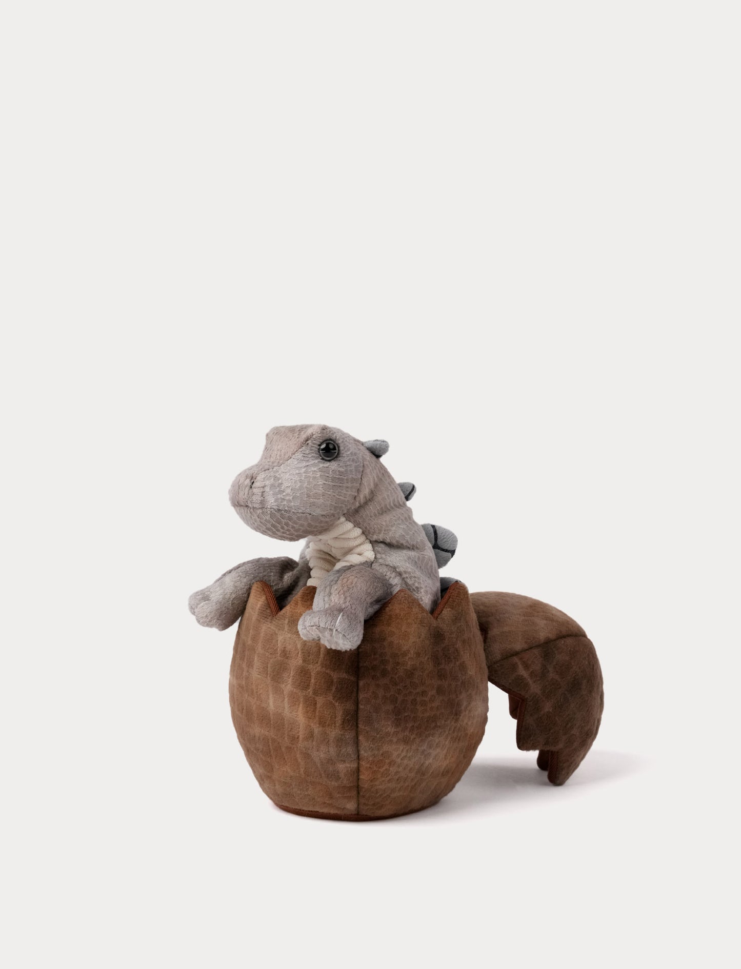 Dino hand puppet plush in dino egg