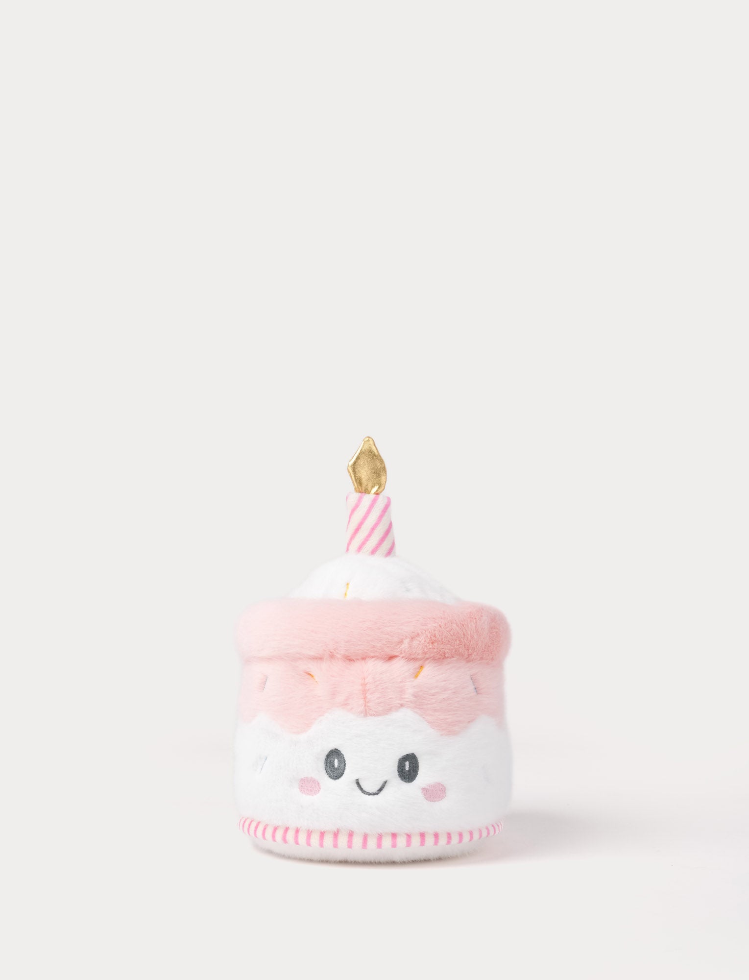  Image of Pink plush toy resembling a birthday cake with a candle on a white background