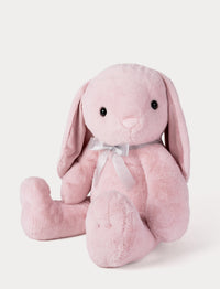 Pink plush bunny with a white bow on a light gray background